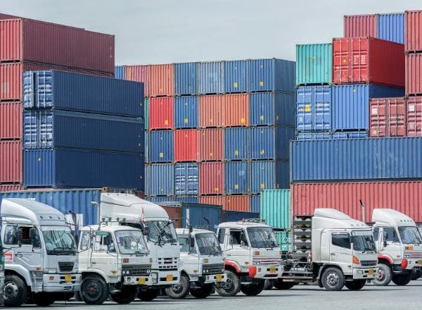 Logistics fleet vehicles with GPS tracking devices for real-time vehicle monitoring, fleet management, and asset tracking